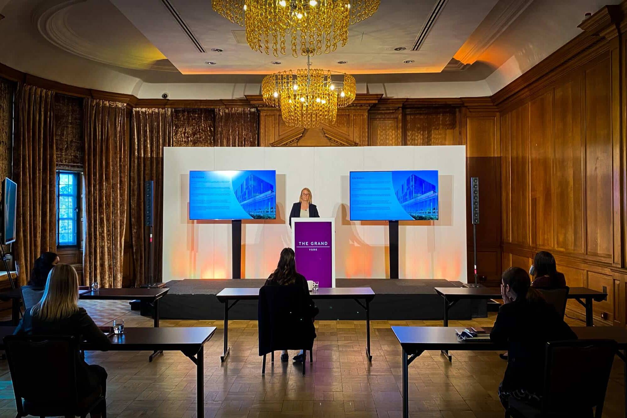 Hybrid event equipment including camera, lighting and screens provided for a conference at York Grand Hotel